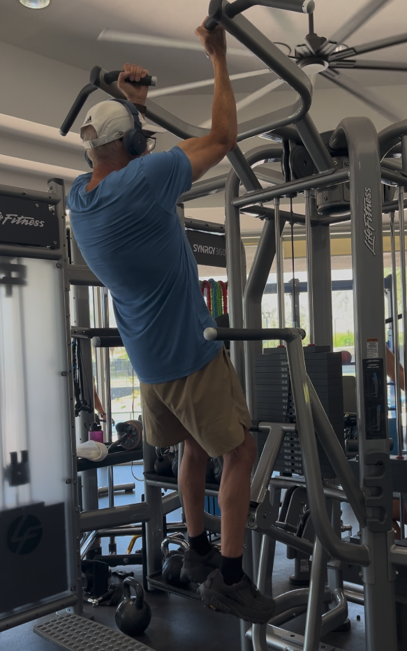 Older adult performing a chin-up exercise